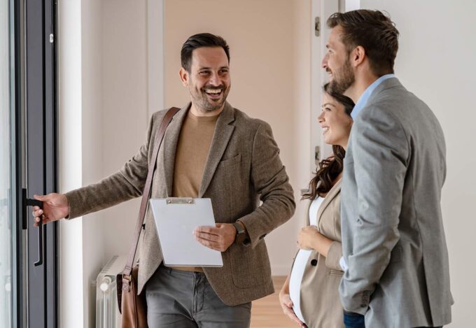 Couple meets with REALTOR to buy a house.