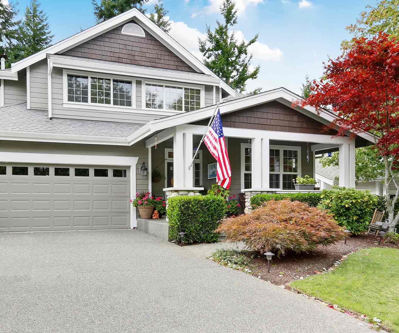 Exterior of a home that qualified for a VA loan displays the American flag.